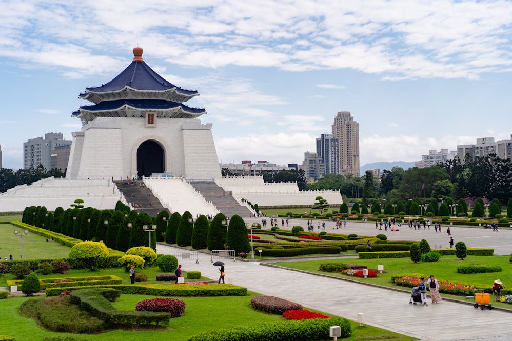 Chiang Kai Shek Memorial Hall pagoda with green lawns and flowers in downtown Taipei